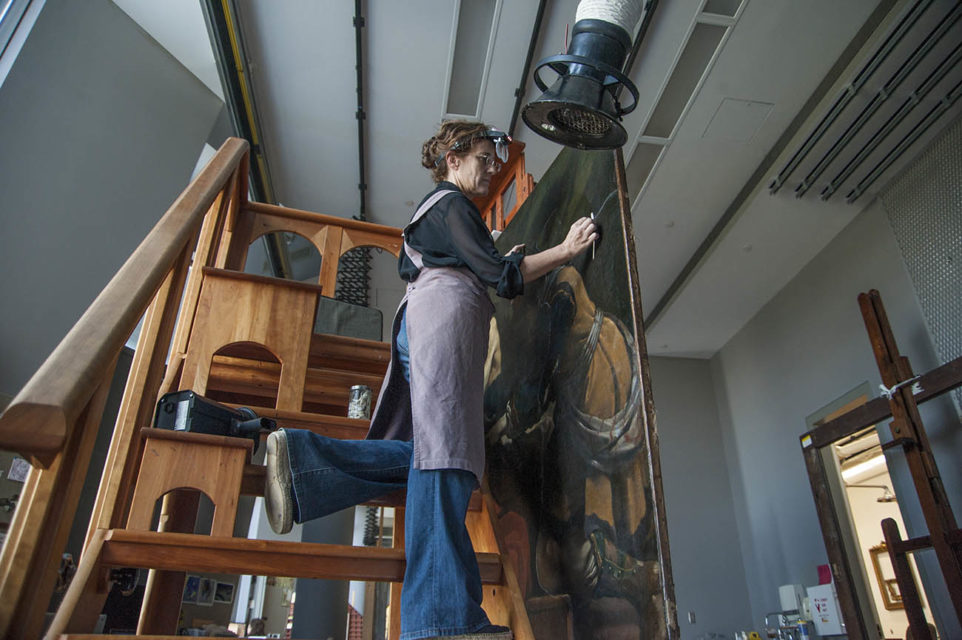 Getty Paintings conservator Devi Ormond cleans Guercino's 'Jacob Blessing the Sons of Joseph', c. 1620. Photo © Getty Museum