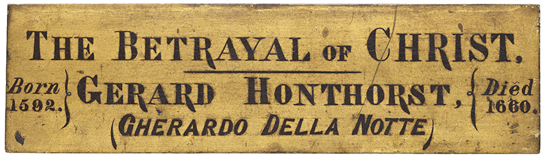 Photo of a nameplate attached to the frame of Caravaggio's painting