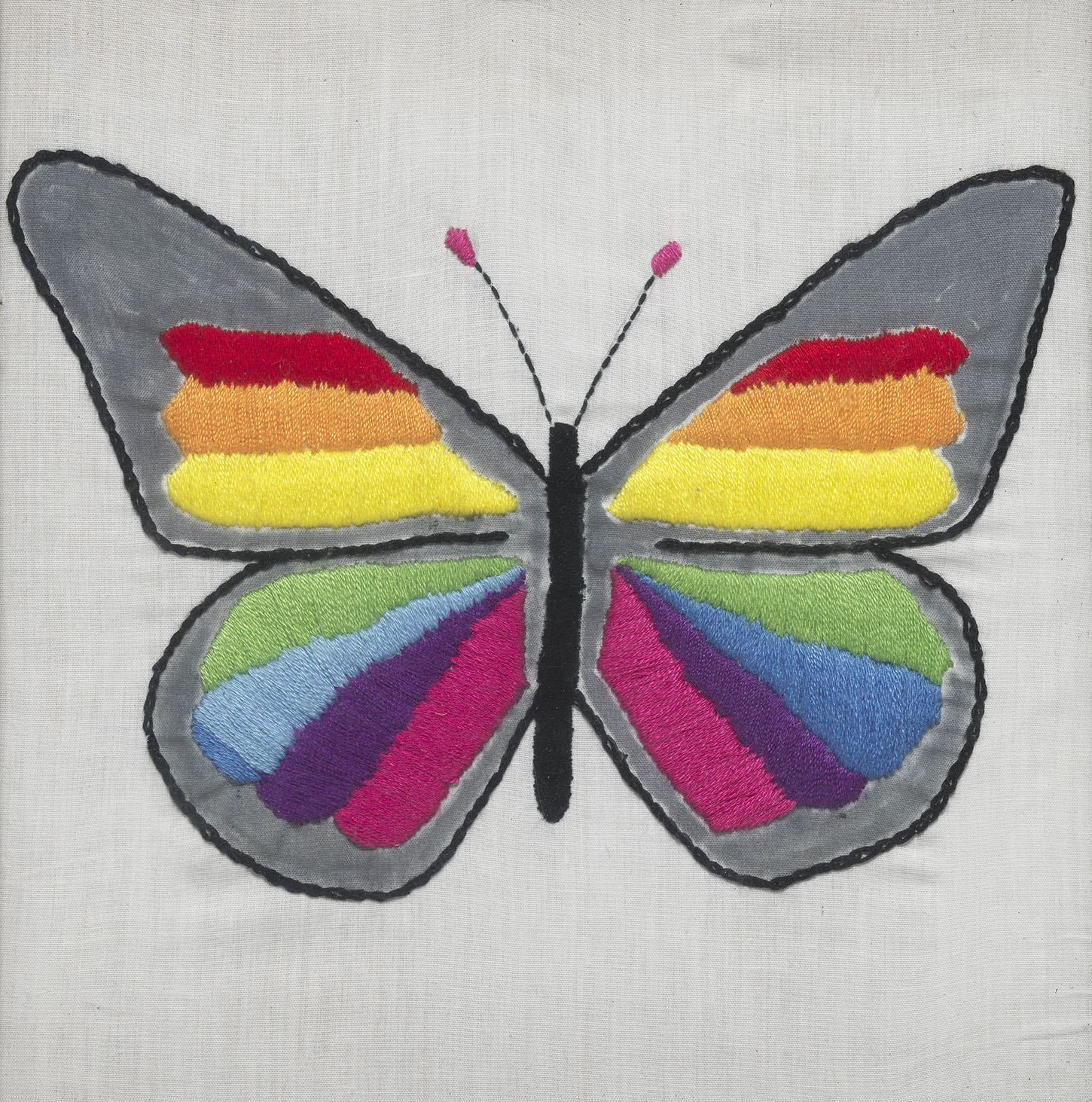Embroidered butterfly with rainbow-coloured wings
