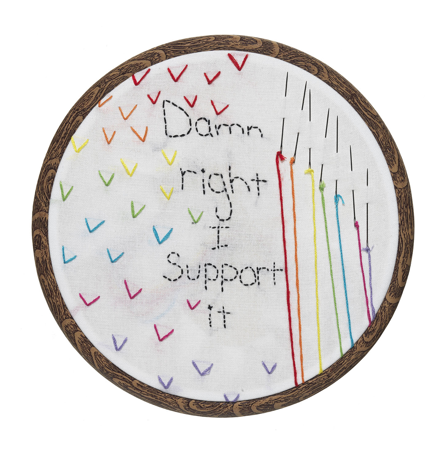 Embroidery hoop with white fabric embroidered with rainbow-coloured thread with text reading Damn right I support it