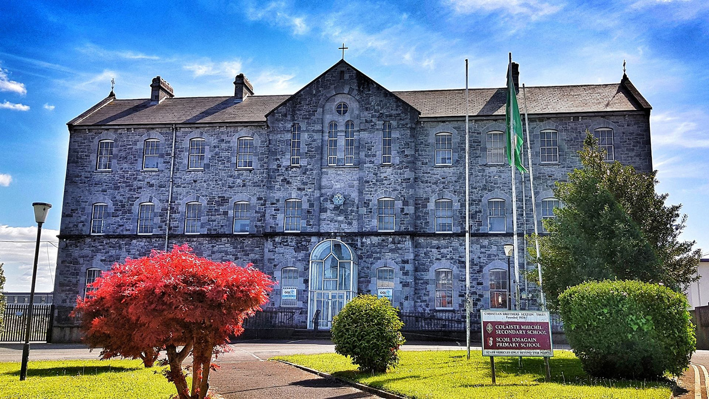 Vibrant photo of a large stone building on a sunny day