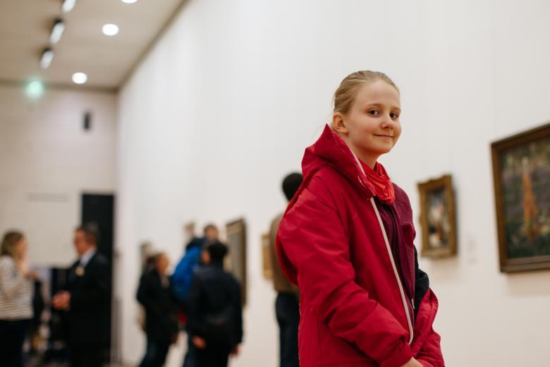 A young girl in an art gallery