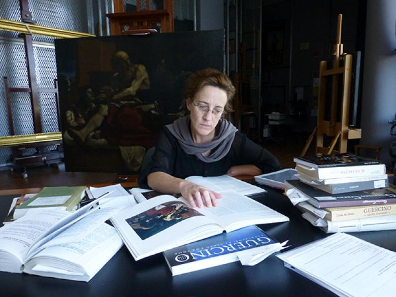 In preparation for conserving Jacob Blessing the Sons of Joseph, the Getty’s associate conservator Devi Ormond researches the history of the painting. Photo © Getty