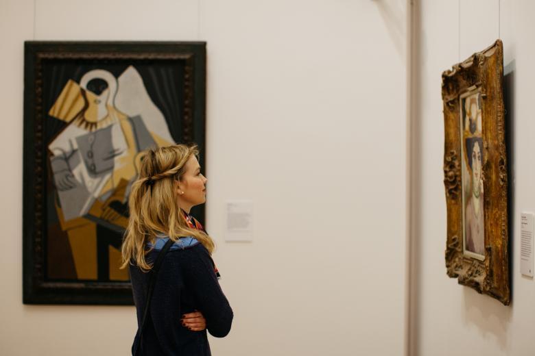 Woman looking at a painting