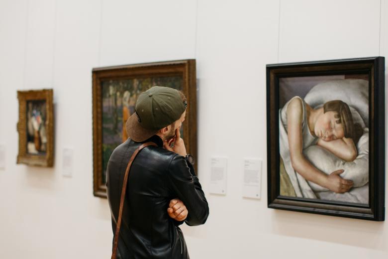 A visitor in front of a painting by Ernest Proctor. © National Gallery of Ireland.
