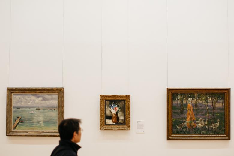 A visitor in front of Stanley Royle's The Goose Girl. © National Gallery of Ireland.