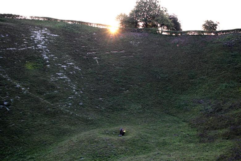 Artist Garrett Phelan recording sound in the field where the Battle of the Somme took place.