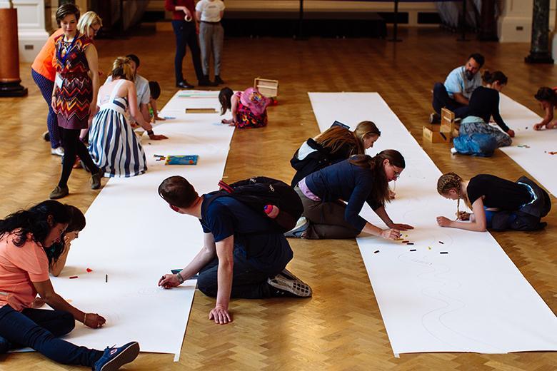 People taking part in a drawing activity in the National Gallery of Ireland.