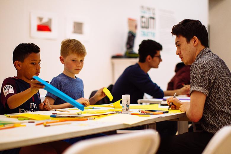 Children taking part in a creative workshop in the Gallery.