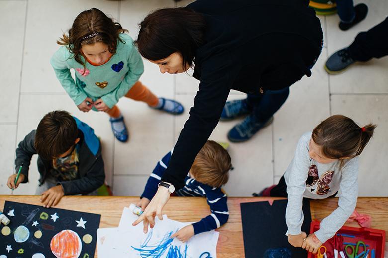 Aerial photo of four children and a woman taking part in a family creative workshop in the National Gallery of Ireland
