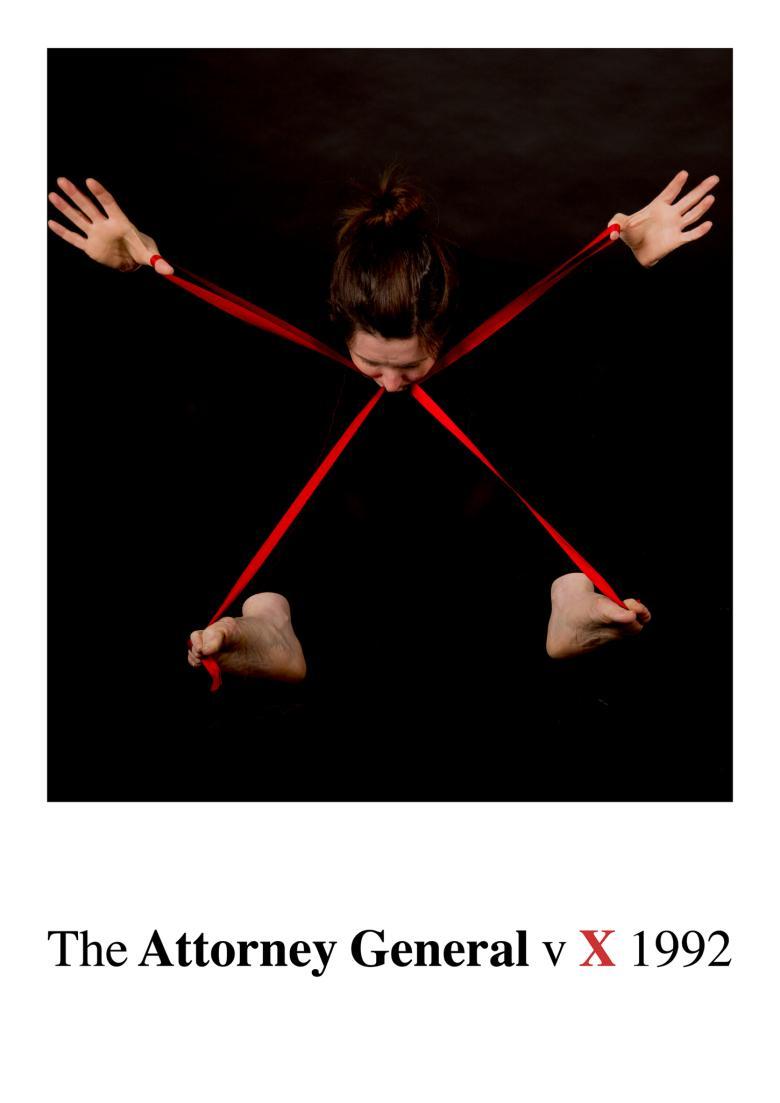 Emerging from a black background we see the head of a woman, eyes cast down, and her hands and feet. There is a red ribbon in the shape of an X connecting the part of her body we see.