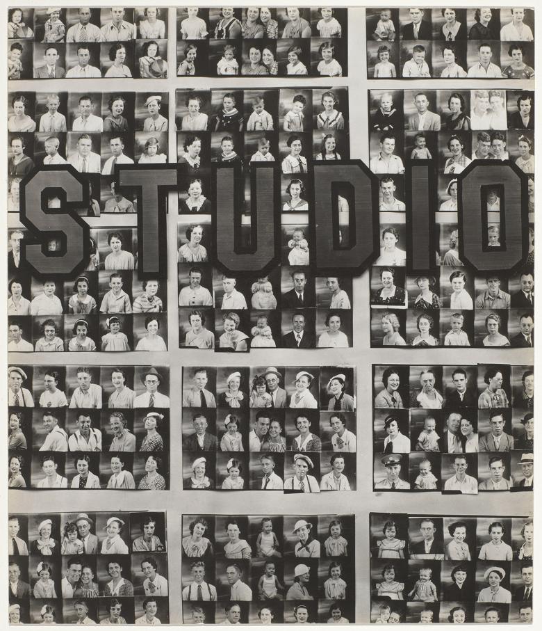 Black and white photo of a photography studio window filled with passport-size photos of people. The word studio is written on the window.