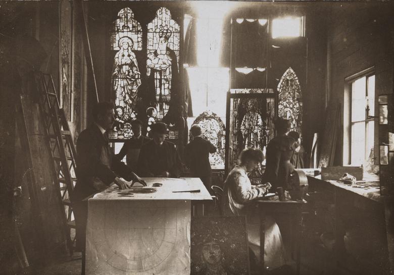 Vintage black and white photo of a stained glass studio
