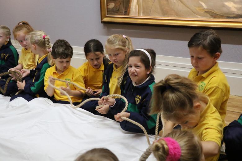 Group of school children taking part in an interactive tour of the Sorolla exhibition