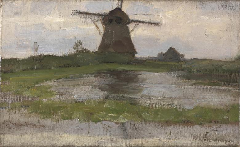 A view of a windmill in the countryside