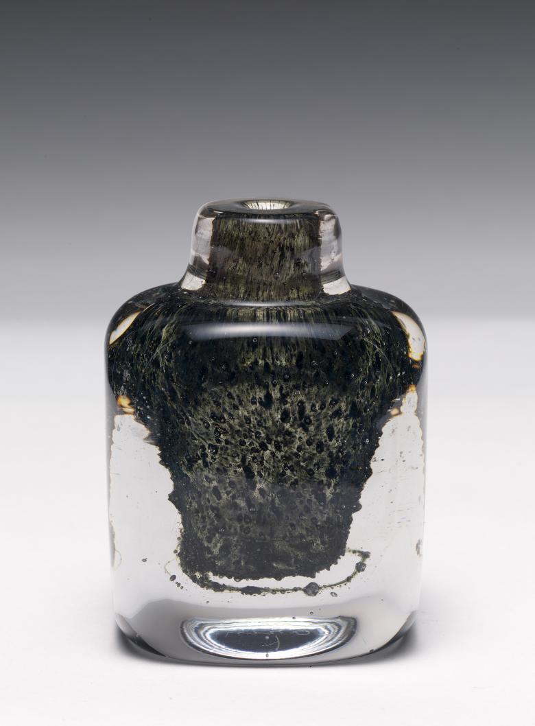 A photograph of a decorative glass bottle