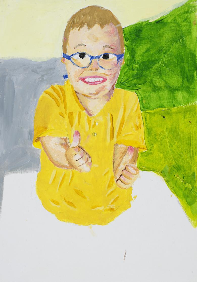 A portrait of a young boy in a yellow t-shirt and blue glasses. He is smiling and has both hands outstretched with his thumbs up.s