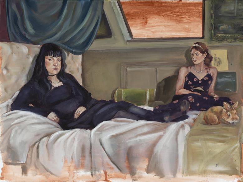 Two figures recline on an unmade bed under a skylight with a red sky. One is dressed all in black and looks at the viewer. The second is wearing a floral dress and gazes off the left. At the foot of the bed is a small rabbit. 