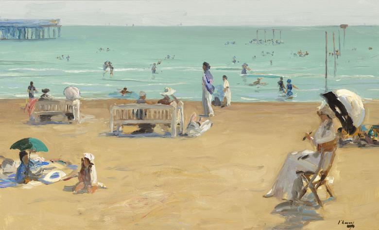 In the foreground, ladies in white dresses and children recline on the beach, some under sun parasols. Further out, people are swimming in the blue water. 