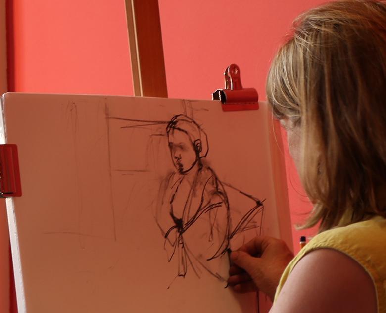 A woman taking part in a life-drawing class in the Gallery