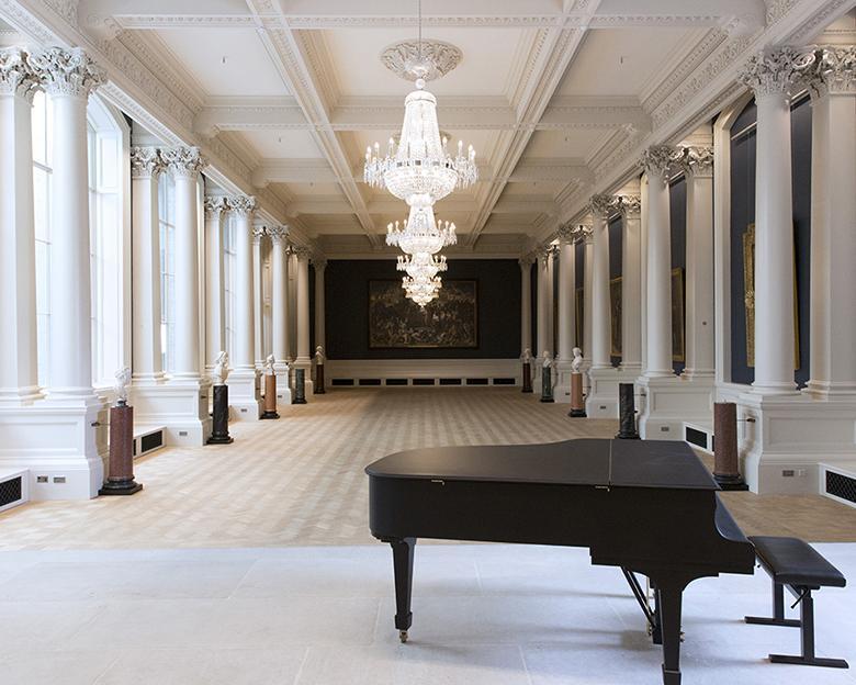 View of the Shaw Room at the National Gallery of Ireland, with a piano in the foreground.