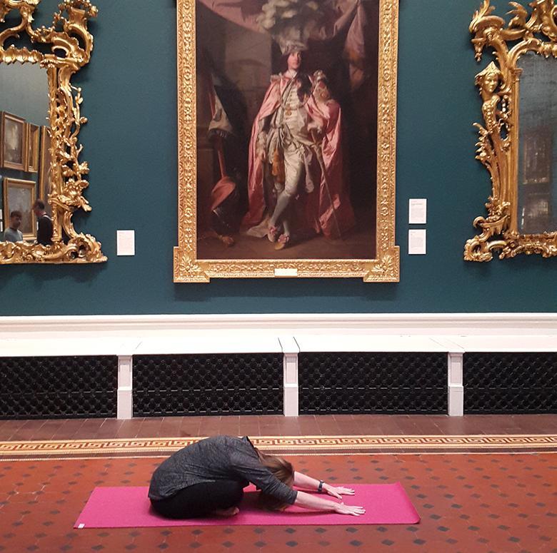 A yoga class taking place in the Grand Gallery of the National Gallery of Ireland.