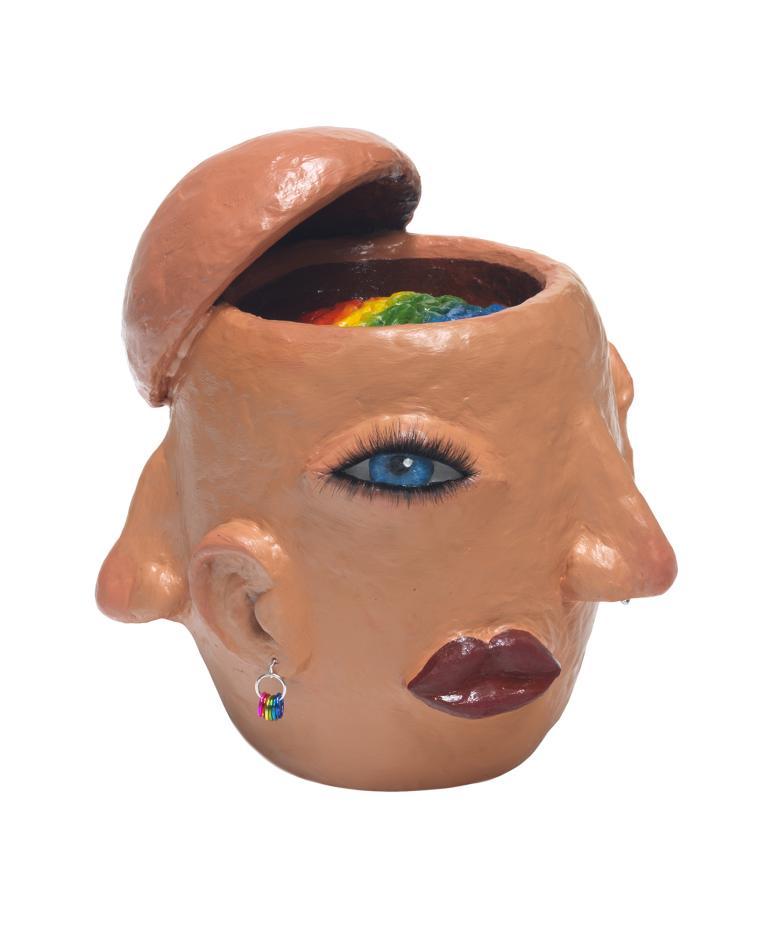 Head sculpted in clay with various facial features all around and top of skull open to reveal rainbow-coloured brain.