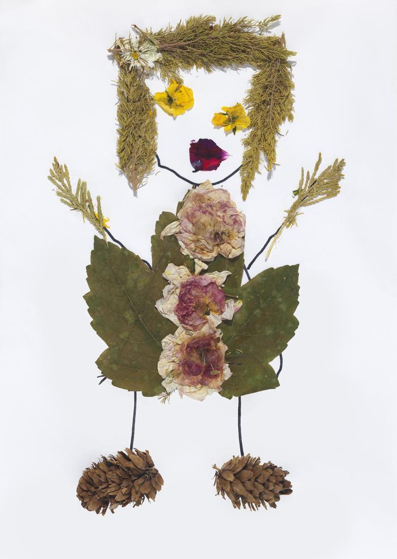 Collage of a girl made of leaves, flowers and branches