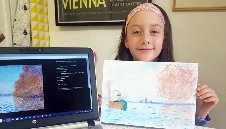 Child holds a hand drawn painting inspired by Monet