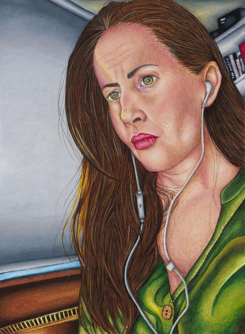 Portrait of a woman with long brown hair wearing a green open-neck shirt and white headphones. In the background a window with its blind closed and a glimpse of bookshelves