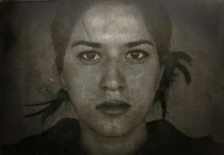 Black and white photo of a young woman.
