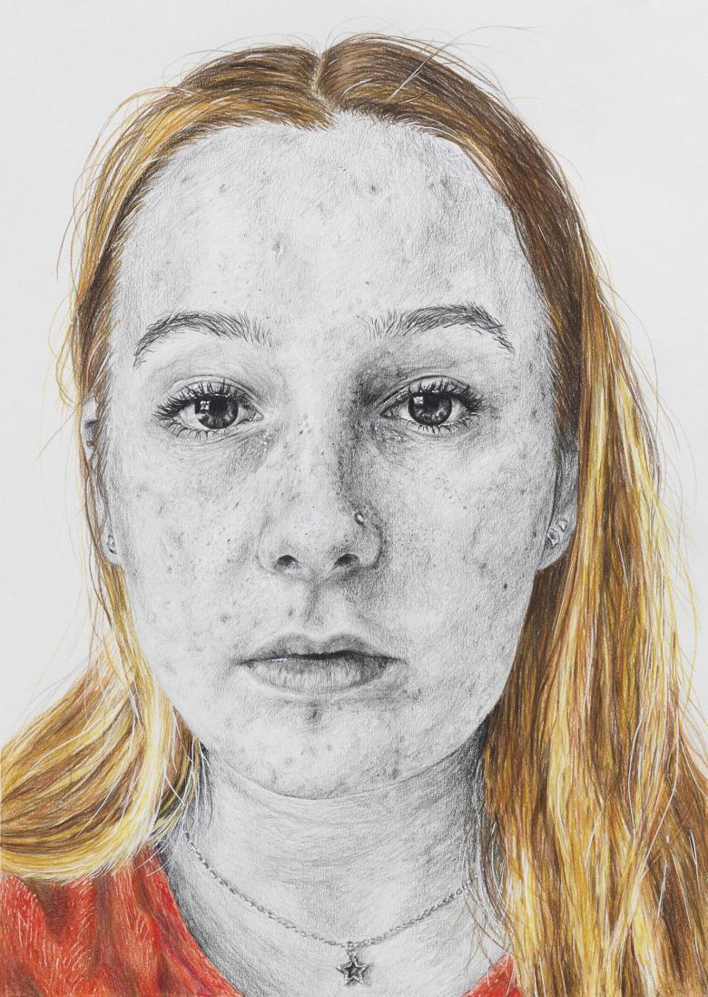 Close-up portrait of a young woman with a highly detailed face drawn in graphite, with colour used to depict her blonde hair and red top.