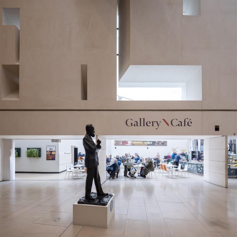 Photograph of the Gallery cafe, with a bronze statue of George Bernard Shaw in the foreground.