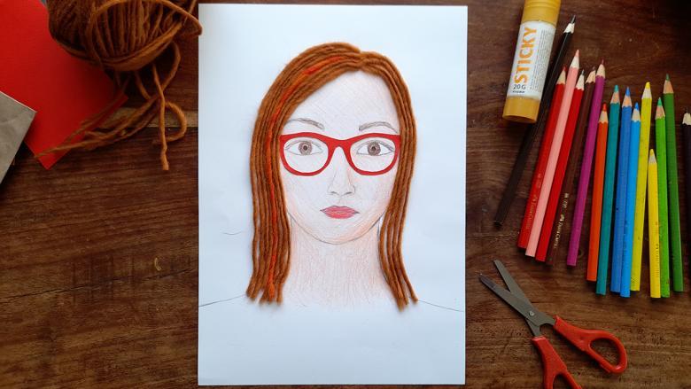 Portrait of a young woman with red glasses and red wool hair