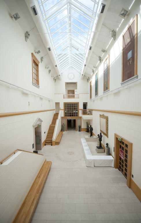 A photo of the Atrium Space in the Gallery, taking in the glass skylights overhead