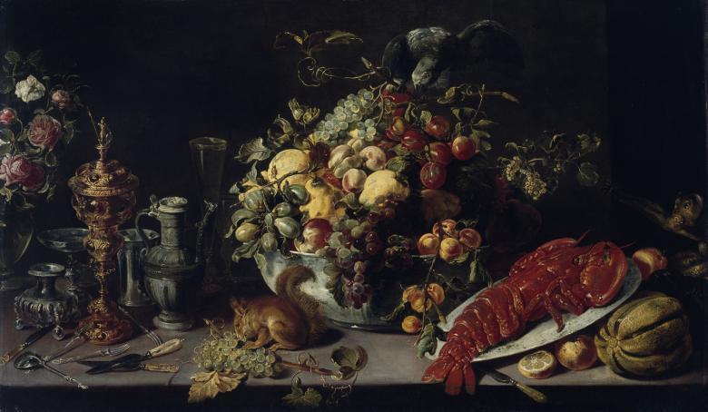 A view of a banquet table. Among the food shown (lobster, fruit, vegetables) we see a squirrel on the table, and to the right, a small monkey.