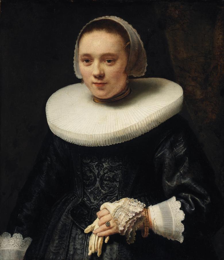 A half-length portrait of a young woman wearing a black dress, wide white ruff and white cap. In one hand she holds a glove.
