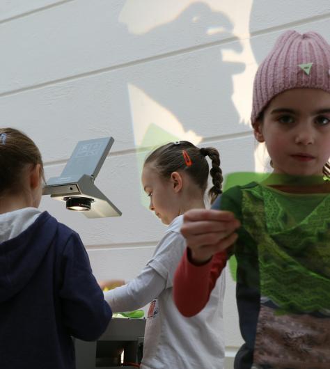 Three children at an art workshop