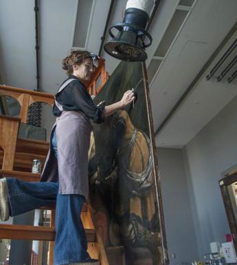Getty Paintings conservator Devi Ormond cleans Guercino's 'Jacob Blessing the Sons of Joseph', c. 1620. Photo © Getty Museum