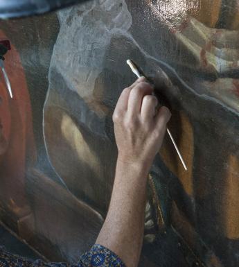 Getty Paintings conservator Devi Ormond cleans Guercino's 'Jacob Blessing the Sons of Joseph', c. 1620. Photo © Getty Museum