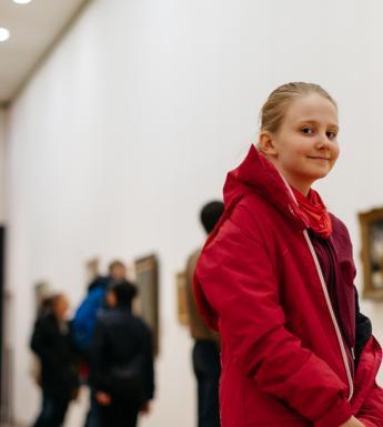 A girl in the exhibition rooms in the Millennium Wing.