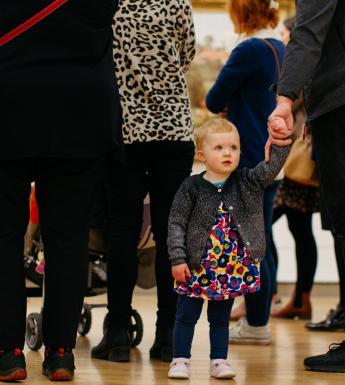 A young child on a free family friendly tour in the Millennium Wing. © National Gallery of Ireland