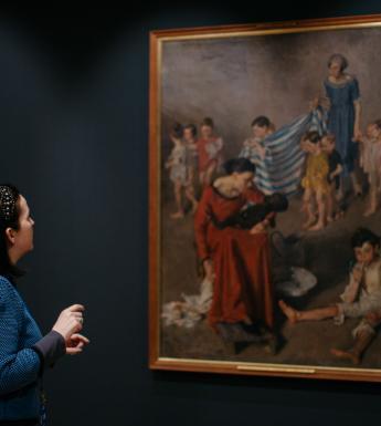 Niamh MacNally in front of a Margaret Clarke painting. © National Gallery of Ireland.