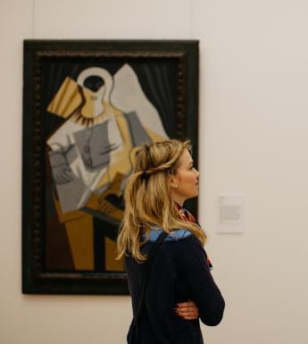 Woman looking at a painting