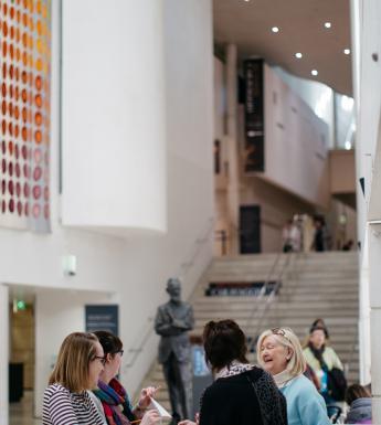Visitors at the information desk of the National Gallery of Ireland