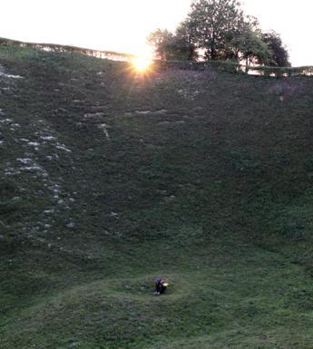 Artist Garrett Phelan recording sound in the field where the Battle of the Somme took place.