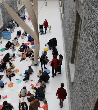 An aerial view of a drop-in family workshop taking place in the Courtyard in the National Gallery of Ireland.