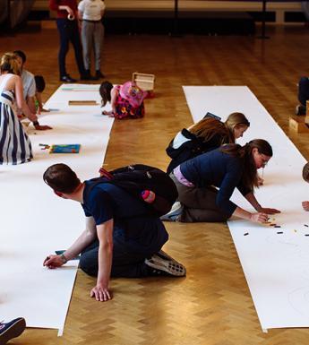 People taking part in a drawing activity in the National Gallery of Ireland.