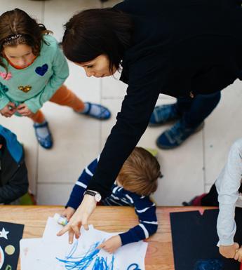 Aerial photo of four children and a woman taking part in a family creative workshop in the National Gallery of Ireland