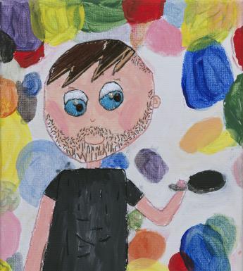 A blue eyed man in a black t-shirt holds a frying pan aloft, as if flipping pancakes. He is surrounded by discs of different colours, so that we can't tell which are the pancakes.